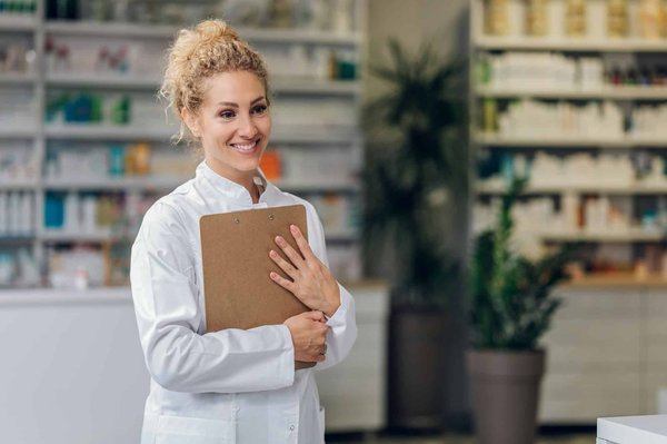 How can UK pharmacists assist in managing drug interactions in patients with multimorbidity?